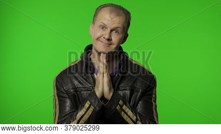 Handsome Rocker Man In Leather Jacket Put Hands In Prayer And Begging, Asking Permission Heartily, L