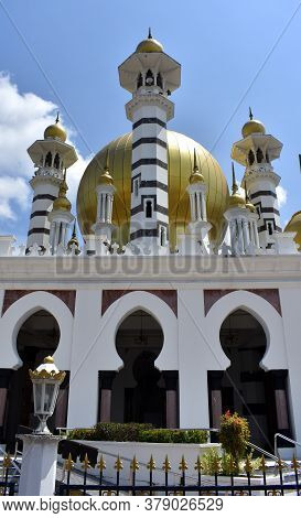 Beautiful Golden Domes And Minarets On A Mosque In Malaysia
