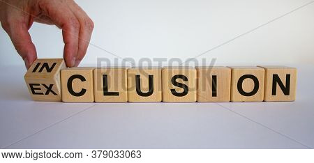 Symbol For A Better Inclusion. Hand Turns Cube And Changes The Word Exclusion To Inclusion. Beautifu