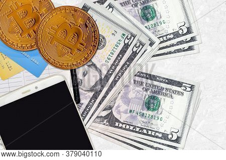 5 Us Dollars Bills And Golden Bitcoins With Smartphone And Credit Cards. Cryptocurrency Investment C