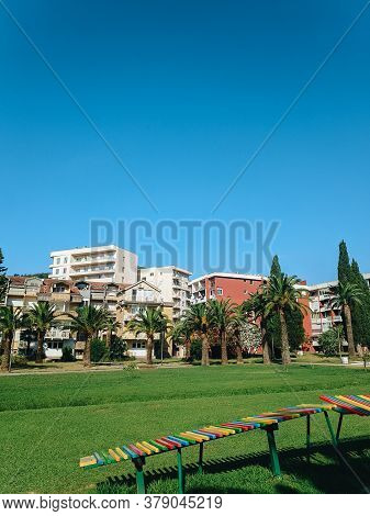 Yugoslavian Houses In The Center Of Budva In Montenegro, Next To The City Park And Green Date Palms,