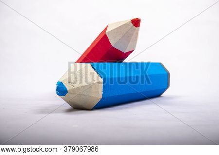 Blue And Red Pencil Stands On A White Background