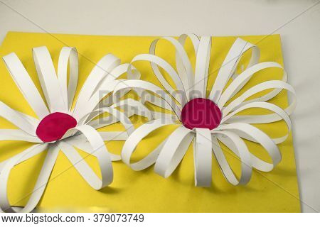 Craft Made Of Colored Paper In The Form Of A Flower On A Yellow Background