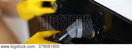 Hands In Rubber Yellow Gloves Brush Ceramic Panel. Steam Cleaner Brush To Remove Dirt In Oven. Clean