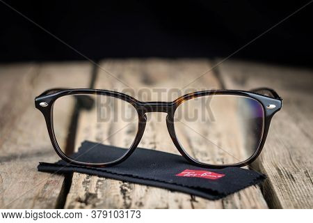 Russia. St. Petersburg / June 20, 2020: Ray Ban Glasses Frame On A Wooden Background