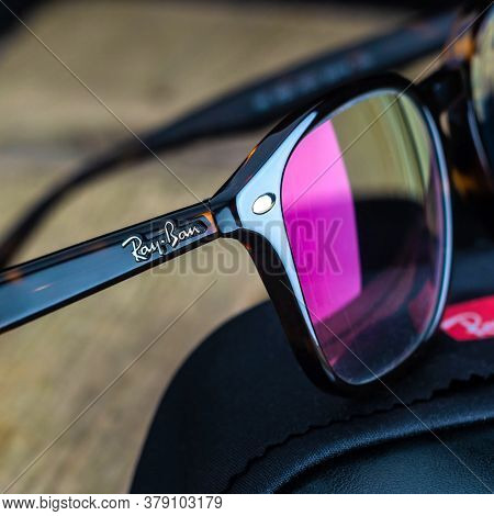 Russia. St. Petersburg / June 20, 2020: Ray Ban Glasses Frame On A Wooden Background