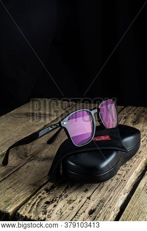 Russia. St. Petersburg / June 20, 2020: Ray Ban Glasses Frame On A Wooden Background