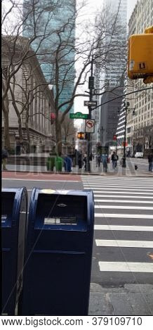 blue mail box in a big city easy to see