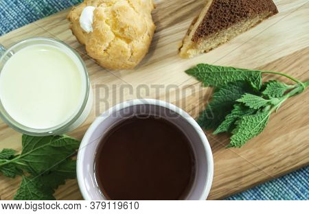 Assortment Of Beverage, Cups With Milk, Compote, Coffee, Tea.
Variety Of Drink On A Wooden Backgroun