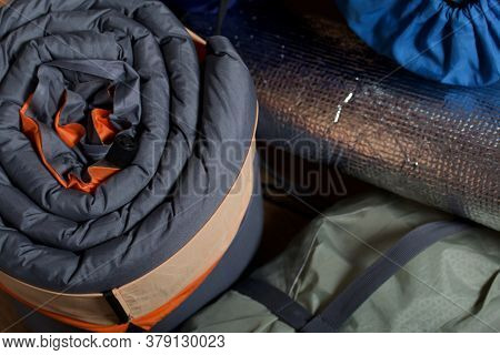 Tourist Equipment. Self-inflating Rugs And Sneakers. Close-up Shot.