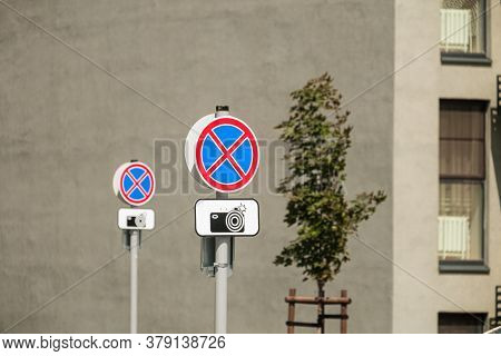 Row Of Road Signs Prohibiting Stop And Parking. Warning Plate About The Photofixation Of Violation O