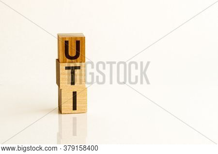 Word Uti - Urinary Tract Infection - On A Wooden Cubes On A White Background