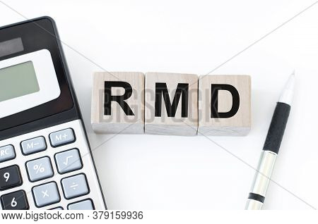 Wooden Block With Words Rmd - Acronim Rmd - Required Minimum Distributions. Concept Image Of Account