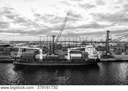 Miami, Usa - March 01, 2016: Containership In Cargo Port. Vessel With Cargo On Cloudy Sky. Container