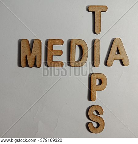 Media Tips Word Presented On White Surface With Wooden Cross Text Cloud Frame Art Business Learning 