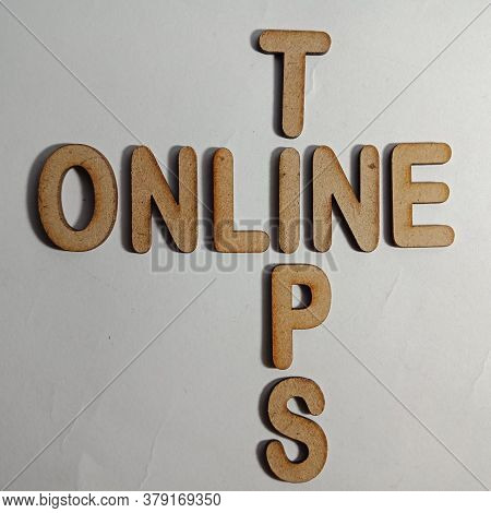 Online Tips Word Presented On White Surface With Wooden Cross Text Cloud Frame Art Business Learning