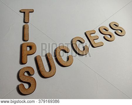 Success Tips Word Presented On White Surface With Wooden Cross Text Cloud Frame Art Business Learnin