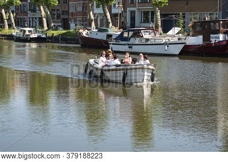 Lokeren, Belgium, July 13, 2020, Motor Boat With Eight People Sails On The Durme In The Center Of Lo