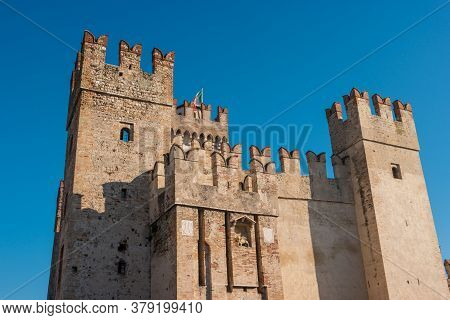 Rocca Scaligera Castle In Sirmione Town On The Garda Lake, Brescia, Italy. High Quality Photo