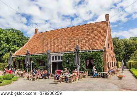 Uithuizen, Netherlands - July 29, 2020: People At The Restaurant Of The Menkemaborg Mansion In Groni