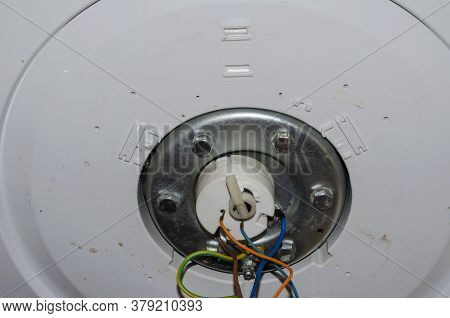 Bottom Of The Outboard Water Heater Before Disassembling. Leaking Home Boiler. Repair And Maintenanc