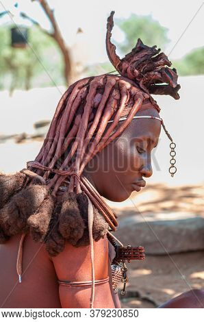 Epupa, Namibia - May 27, 2011: Profile Of A Married Himba Woman With Traditional Hair Locks And Orna
