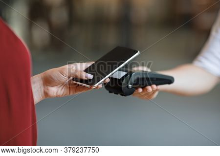 Nfc Technology. Unrecognizable Woman Maiking Contactless Payment With Smartphone To Bank Terminal El