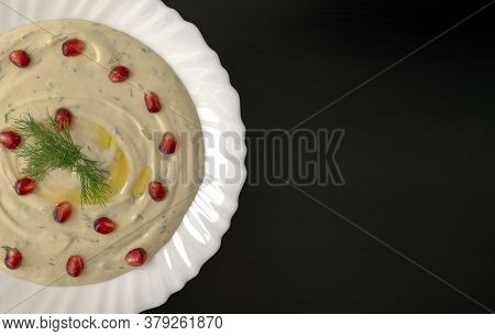 Famous Traditional Arabic, Eastern And Israel Cuisine - Dip Tahini With Pomegranate On Dark Wooden B
