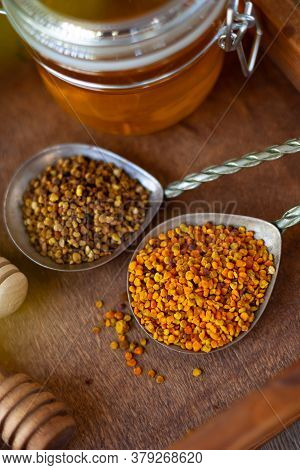 Bee Pollen Granules. Fresh Oney On Wooden Table. Still Life Bee Product Background. Wooden Spoon Wit