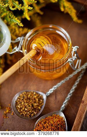 Bee Pollen Granules. Fresh Oney On Wooden Table. Still Life Bee Product Background. Wooden Spoon Wit