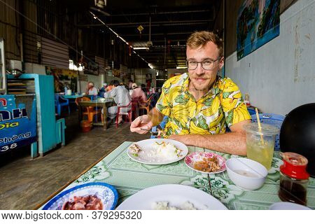 Handsome Caucasian Man In Local Vietnamese Restaurant