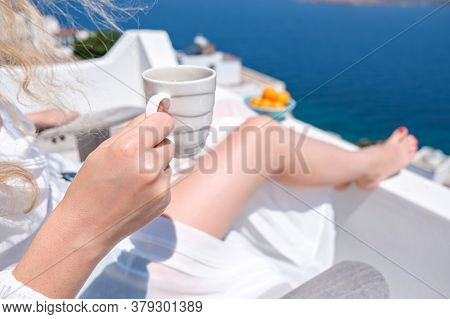 Woman Hand Holding Coffee Cup On Terrace Bacony Of House Or Hotel Sea View
