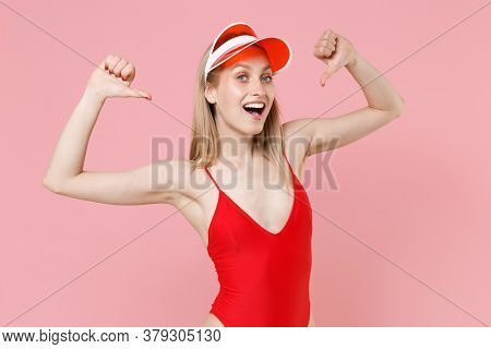 Excited Young Blonde Woman Girl In Red One-piece Swimsuit Cap Posing Isolated On Pink Background Stu