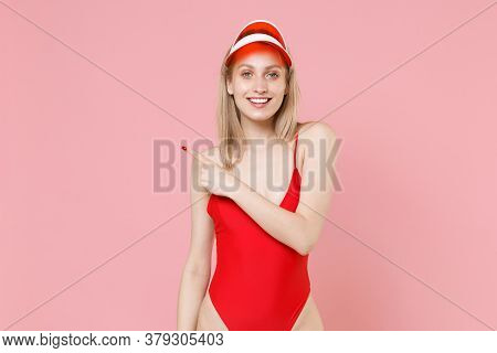 Smiling Young Blonde Woman Girl In Red One-piece Swimsuit Cap Posing Isolated On Pink Background Stu