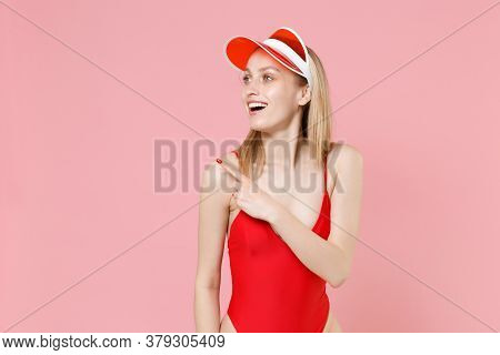 Excited Young Blonde Woman Girl In Red One-piece Swimsuit Cap Posing Isolated On Pink Background Stu