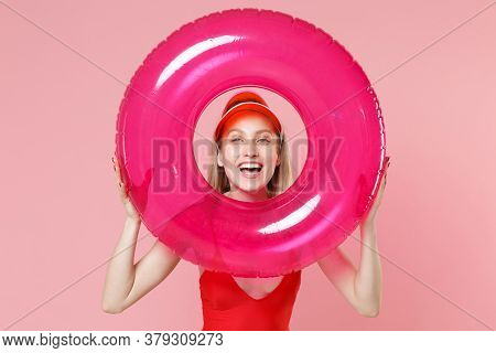 Laughing Young Blonde Woman Girl In Red One-piece Swimsuit Cap Posing Isolated On Pink Wall Backgrou