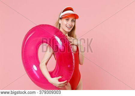 Smiling Young Blonde Woman Girl In Red One-piece Swimsuit Cap Posing Isolated On Pink Background In 
