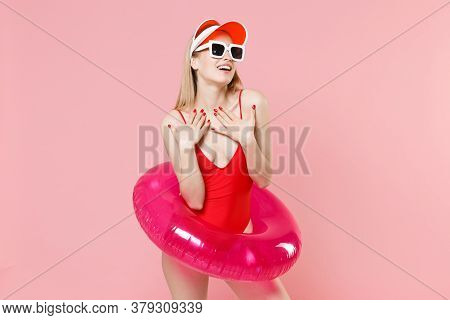 Beautiful Young Blonde Woman Girl In Red One-piece Swimsuit Cap Glasses With Swim Inflatable Ring Po