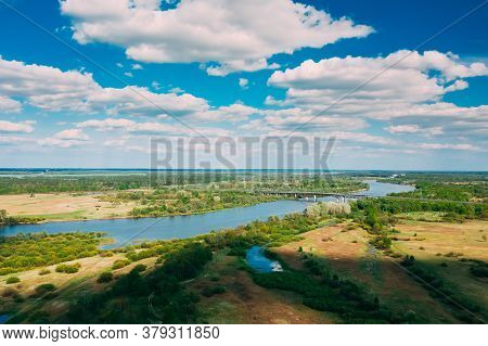 Rechytsa, Gomel Region, Belarus. Aerial View Of Dnieper River. Sunny Sky Above Green Meadow And Rive