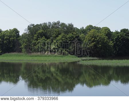 Trees Reflected In Waters Of Artificial Breeding Pond In European Goczalkowice Town At Silesian Dist