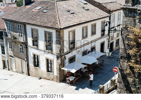 Santiago De Compostela, Spain - July 18, 2020: Restaurant With Terrace In Historical Centre Of Santi