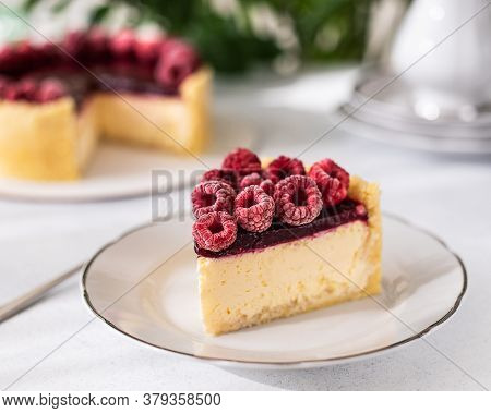 Cheesecake With Raspberries. Raspberry And Raspberry Jelly Cheesecake. Slice Of Cheesecake On A Whit