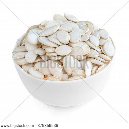 Pumpkin Seeds In A Bowl  Isolated On White Background.