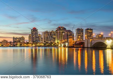 West Palm Beach, Florida, USA downtown skyline on the Intracoastal Waterway at dusk.