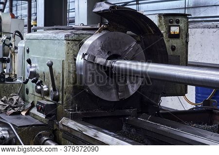 Oiled Lathe With A Workpiece Fixed In The Spindle Faceplate In The Workshop