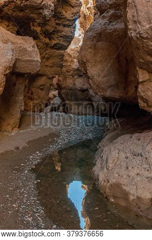 Inside Of The Sesriem Canyon In The Tsauchab River. Water Is Visible
