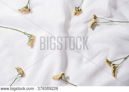 Top View Of Voile Fabric Background With Flowers With Space For Text