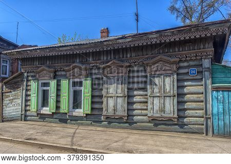 Russia, Irkutsk 06,05,2018 Wooden Architecture Of Siberia. Wooden Houses On Streets In The Center Of