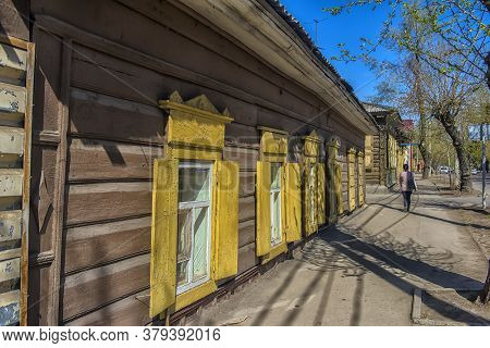Russia, Irkutsk 06,05,2018 Wooden Architecture Of Siberia. Wooden Houses On Streets In The Center Of