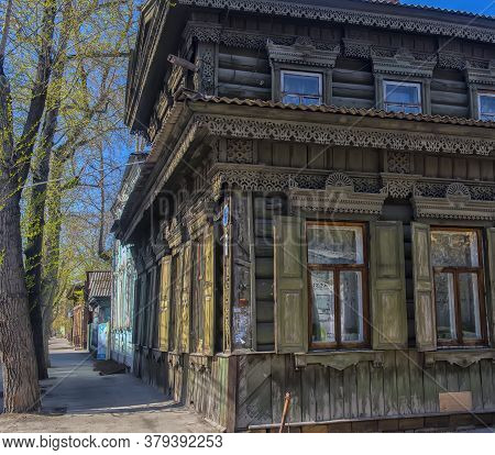 Russia, Irkutsk 06,05,2018 Wooden Architecture Of Siberia. Wooden Houses On Streets In The Center Of